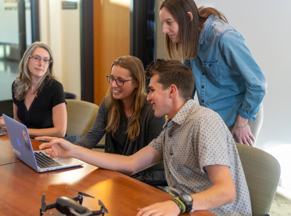 A group of workers collaborating at the office.