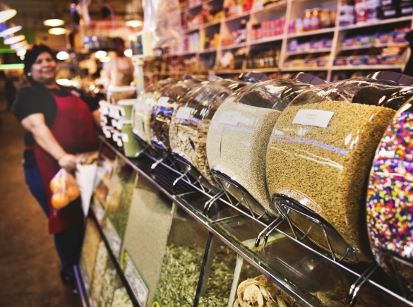 woman in background next to display in grocery store